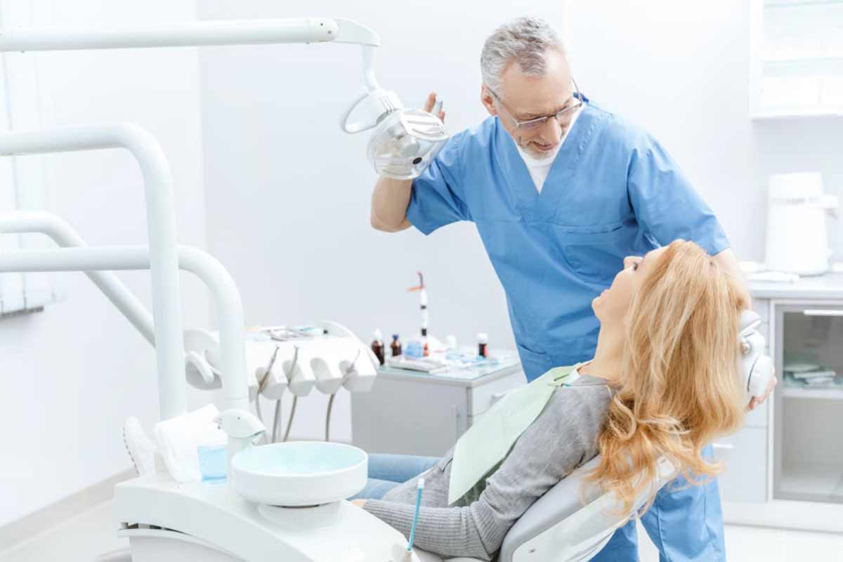 patient being fitted for her same-day dental crowns